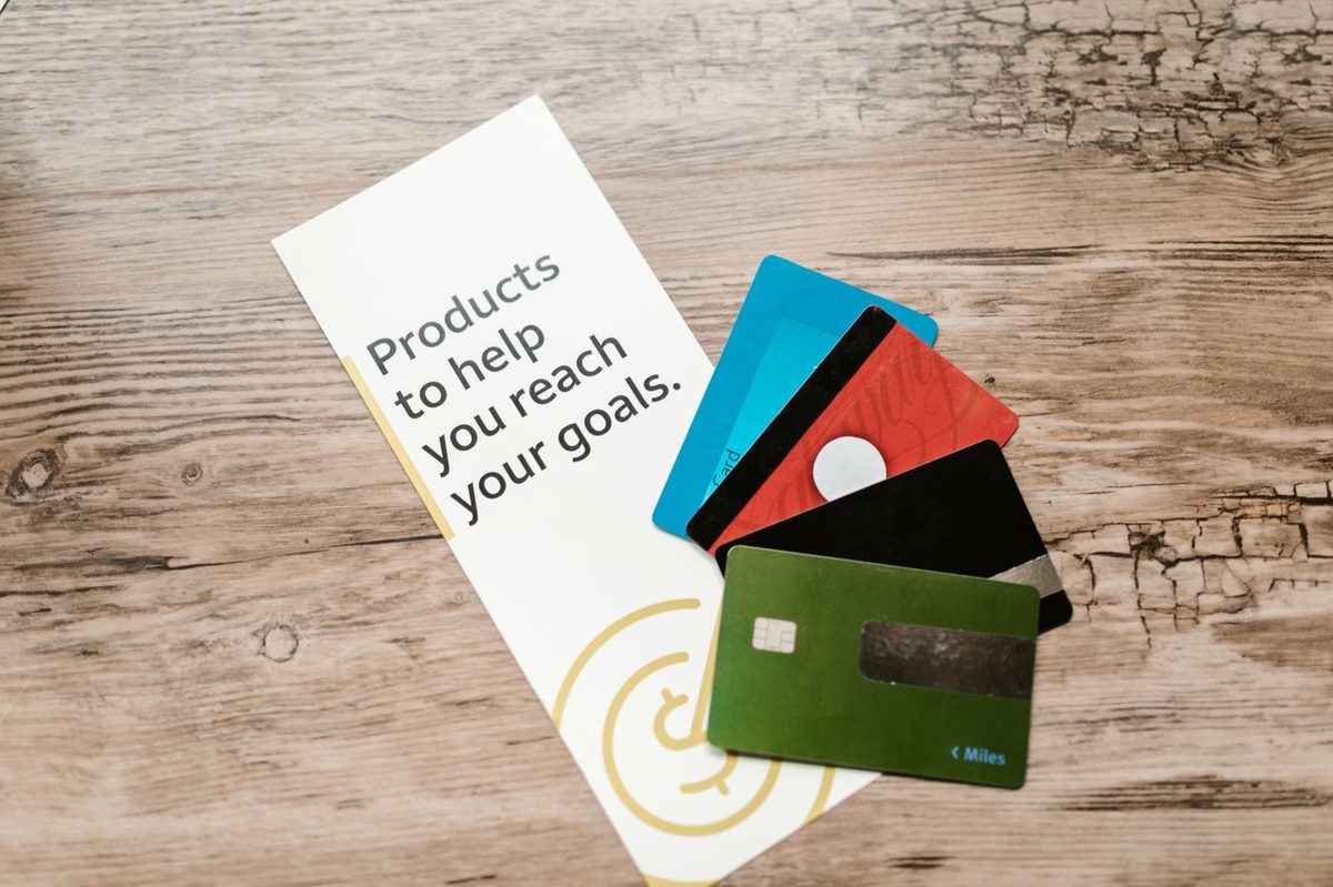 Credit cards fanned out on a wooden table