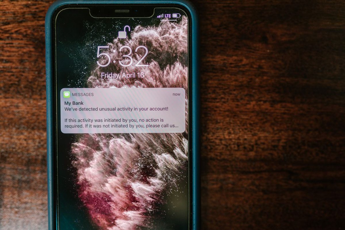 A phone showing a bank notification on screen